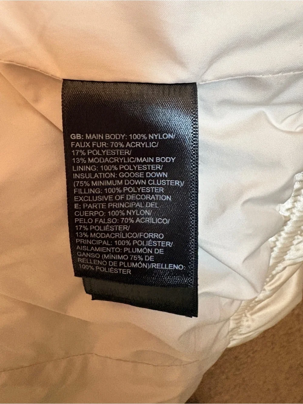 The North Face Girls champagne-colored puffer jacket